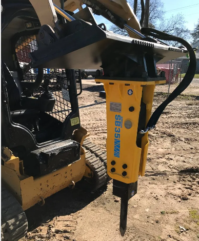 Skid steer with hydraulic breaker